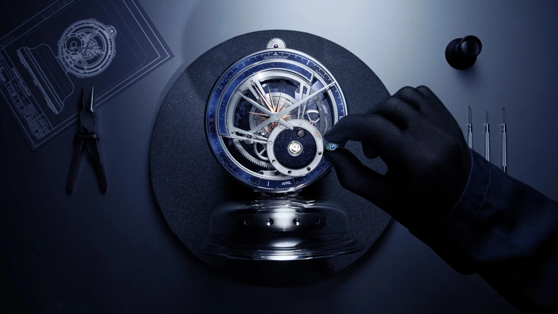 topshot of a watchmaker assembling the atmos tellurium